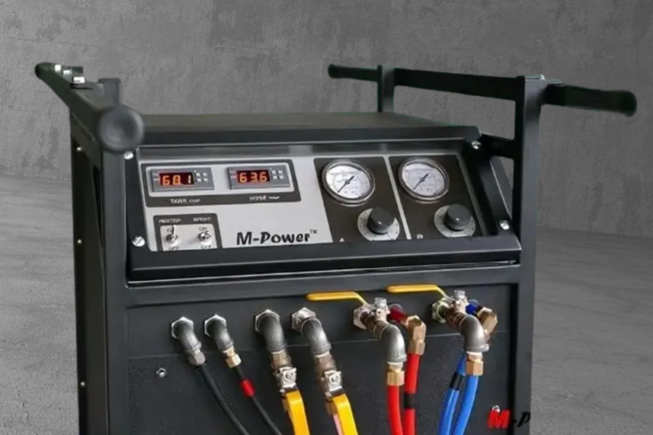 m-power spray foam machine closeup with a cement background